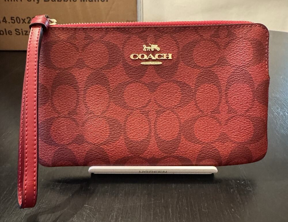 Coach Corner Zip Wristlet In Signature Canvas